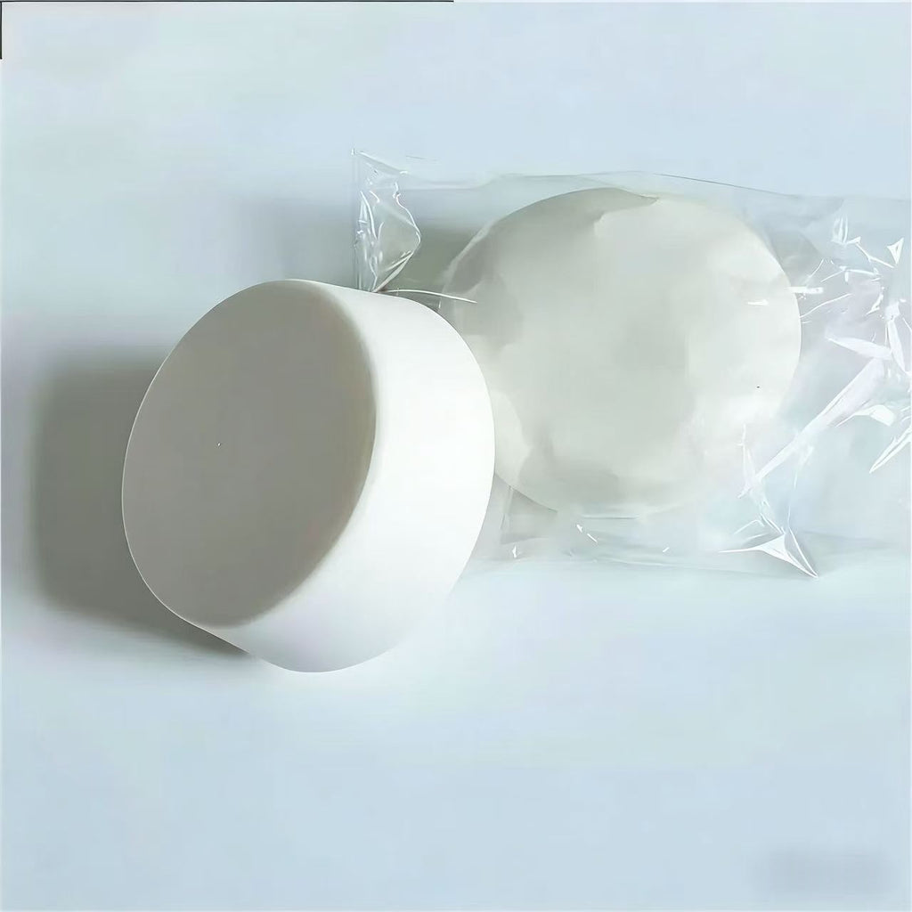 Two white yogurt squishy on a light gray background