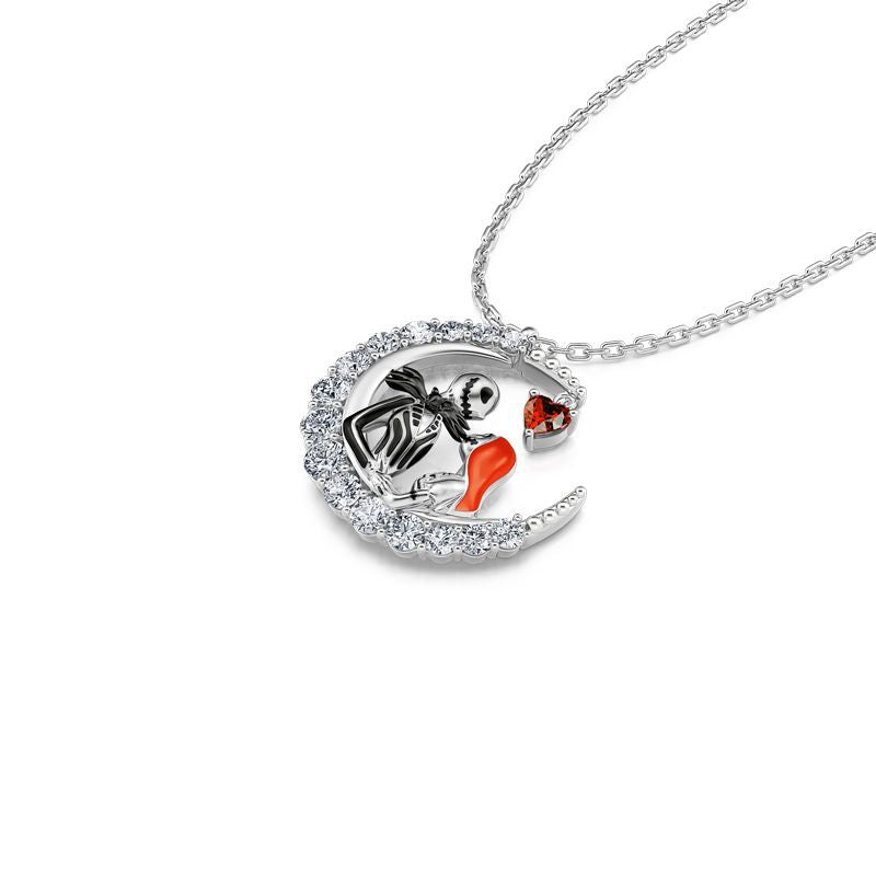 Silver necklace with a pendant featuring a cartoon character and red gemstone on a white background
