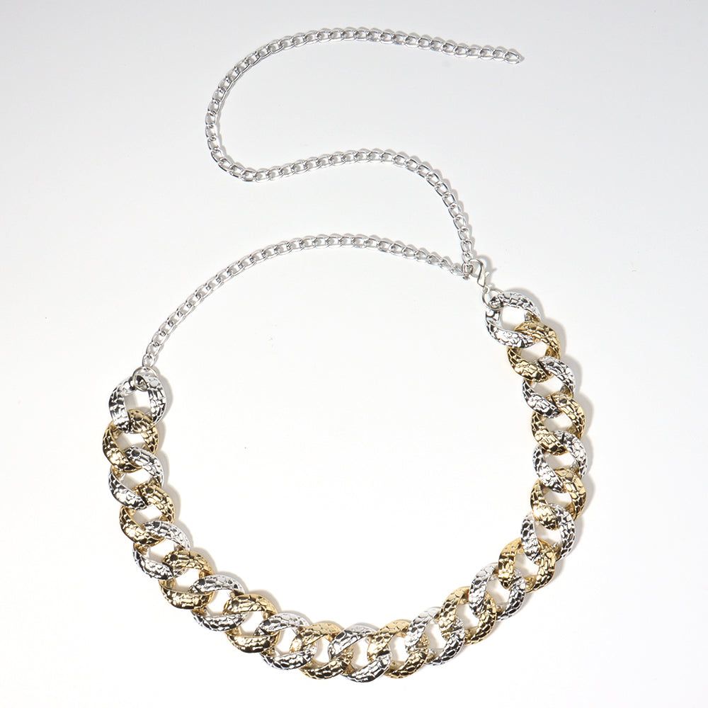Gold and silver chain necklace on a white background
