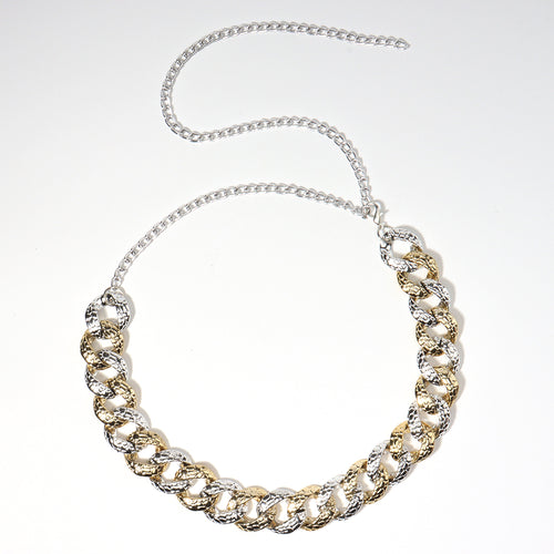 Gold and silver chain necklace on a white background