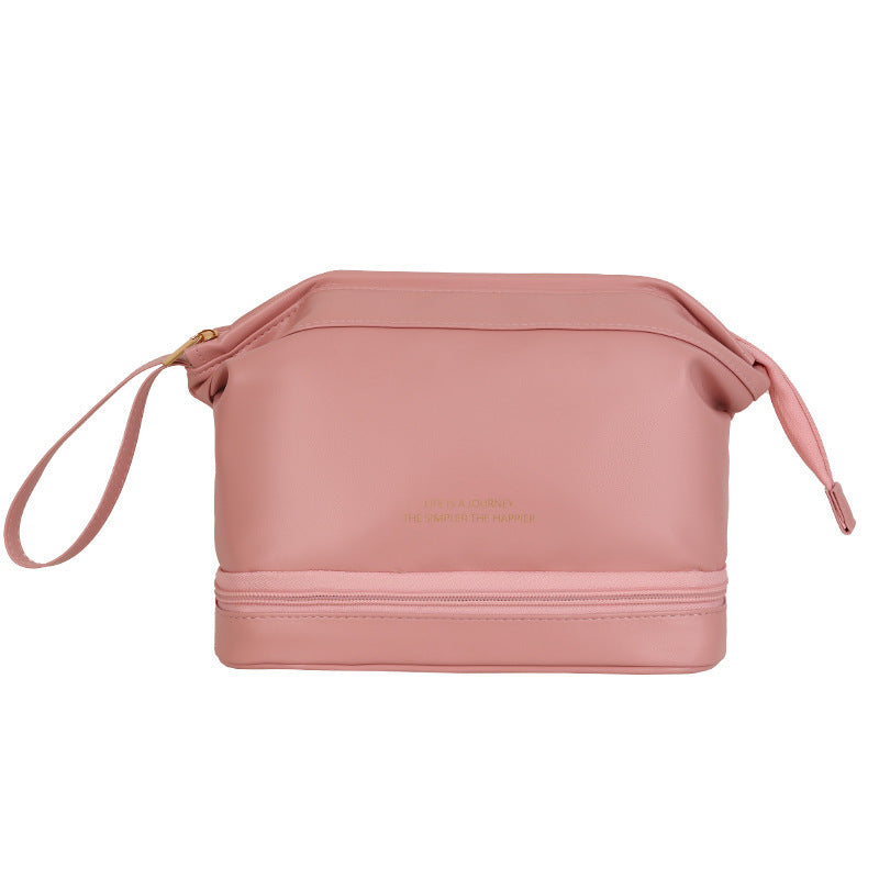 Pink cosmetic bag with a strap on a white background