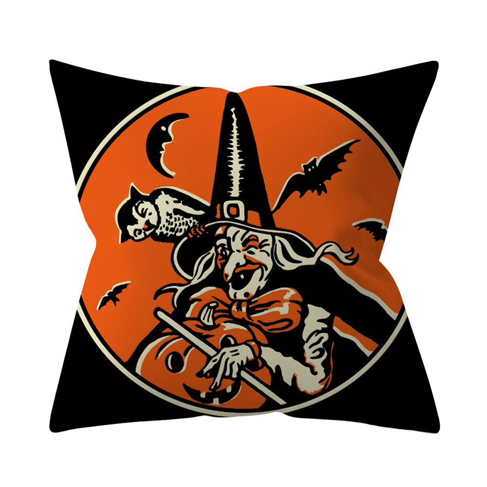 Halloween-themed pillow with skeleton, owl, and bats on an orange background