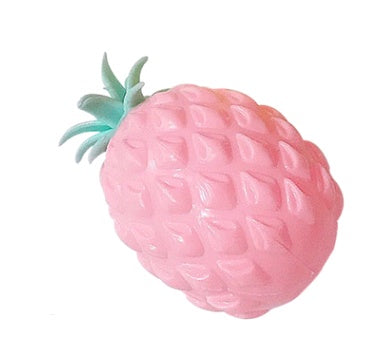 Pink pineapple-shaped squishy toy with a green leaf on a white background