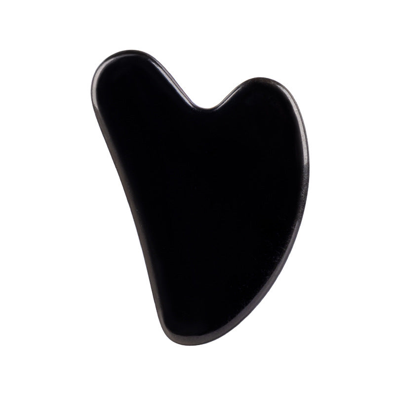 Black Gua Sha tool on a white background