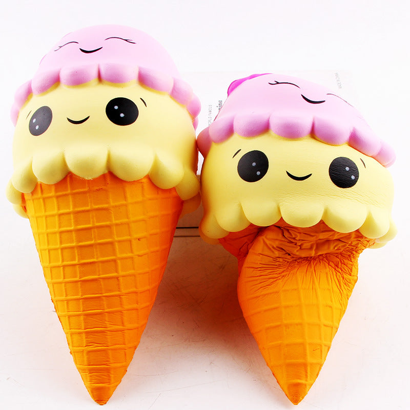 Two cute ice cream cone toys with pink and purple tops on a white background