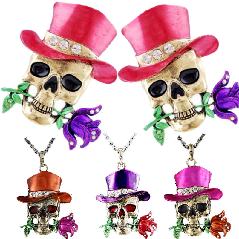 Skull pendants with colorful hats and flowers on a white background