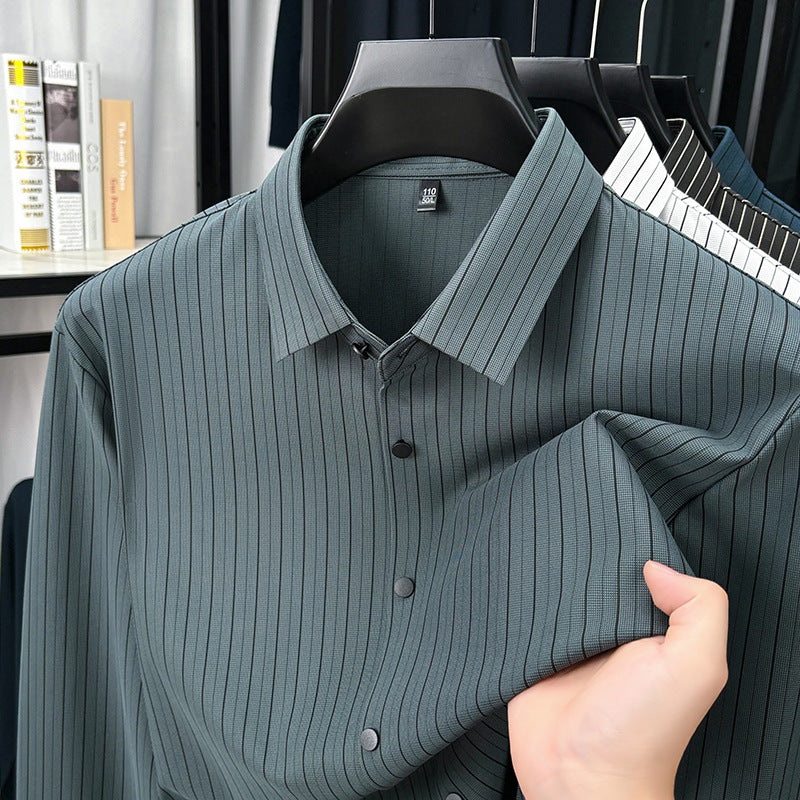 Green ribbed shirt on a hanger with a blurred background