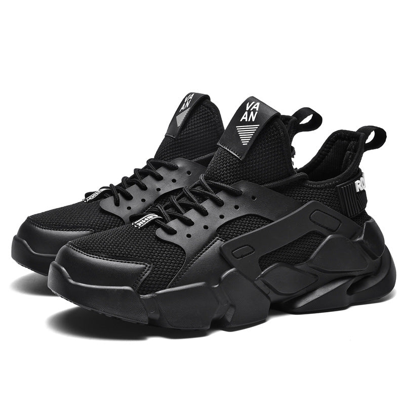 Black sneakers with visible branding on a white background