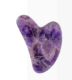 Amethyst crystal heart on a white background