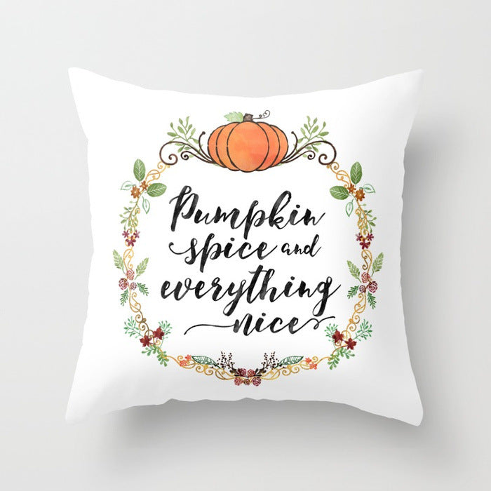 Decorative pillow with 'Pumpkin Spice and everything nice' text and pumpkin design on a white background