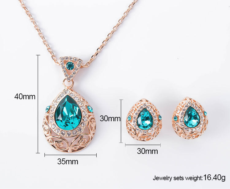 Jewelry set with necklace and earrings featuring blue stones and rose gold accents, with measurements and weight displayed.