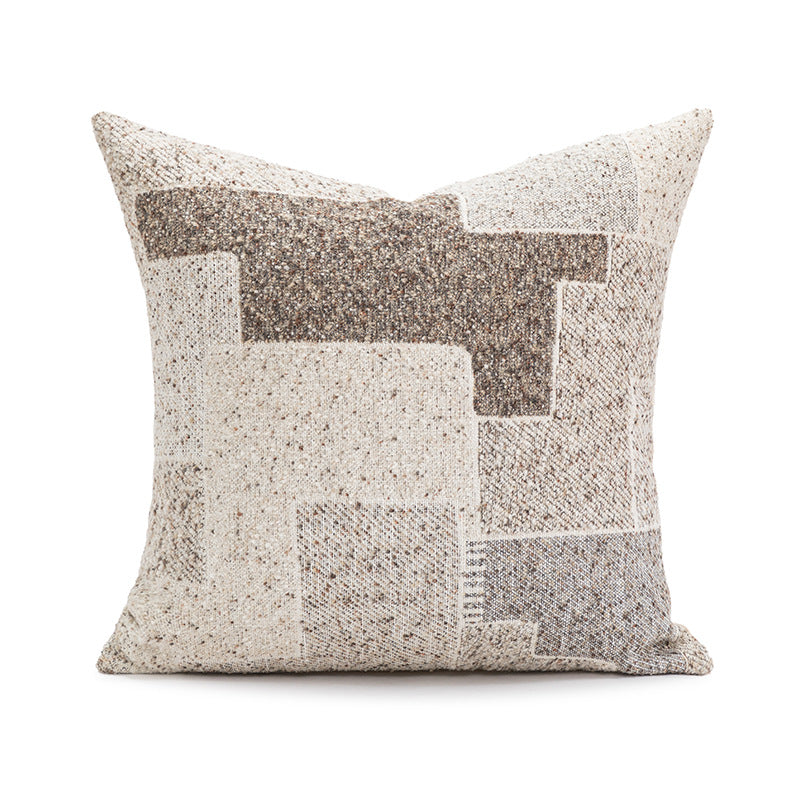 Decorative pillow with geometric pattern on a white background