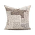 Decorative pillow with geometric pattern on a white background