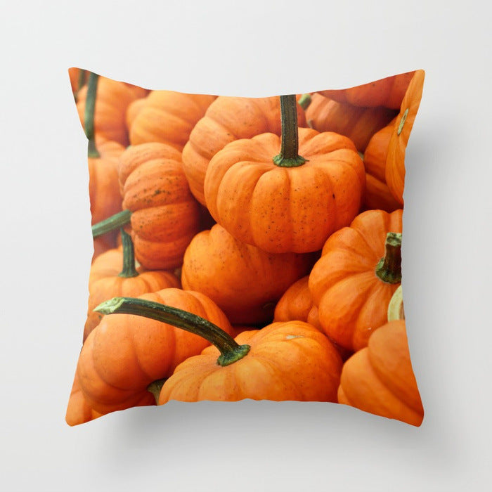 Pillow with pumpkins design on a light gray background