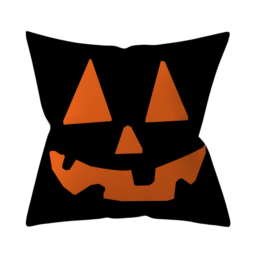 Pillow with a jack-o'-lantern face design on a white background