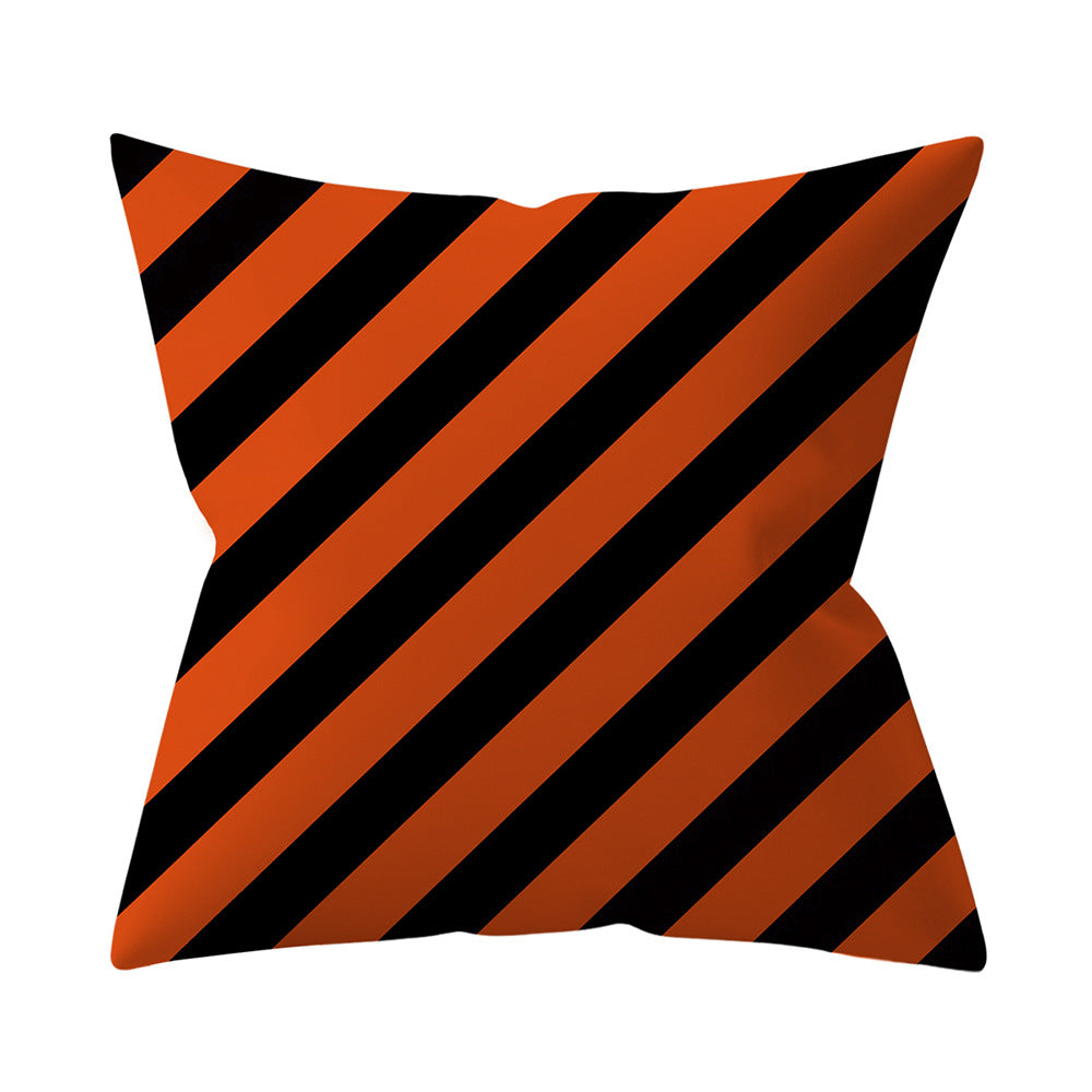 Pillow with black and orange diagonal stripes on a white background