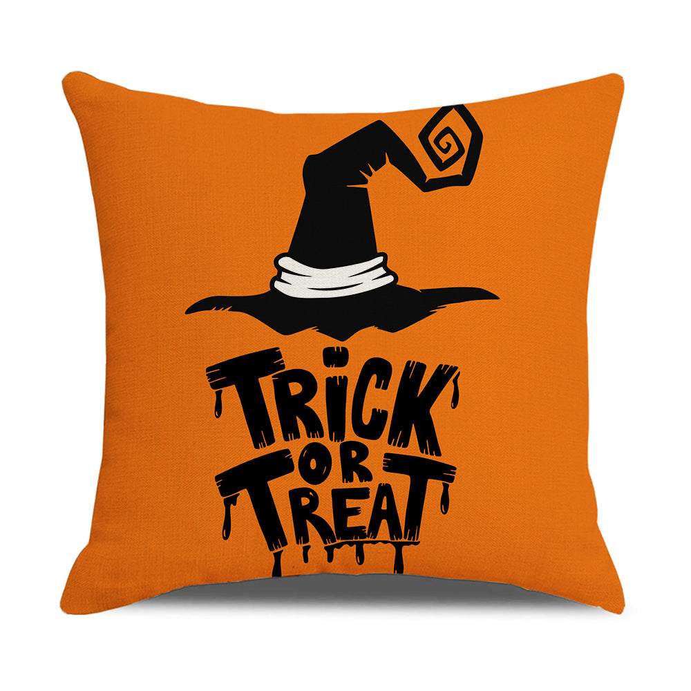 Orange pillow with a black witch hat and 'Trick or Treat' text on an orange background