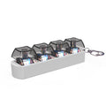 Keychain with transparent compartments containing small electronic components on a white background