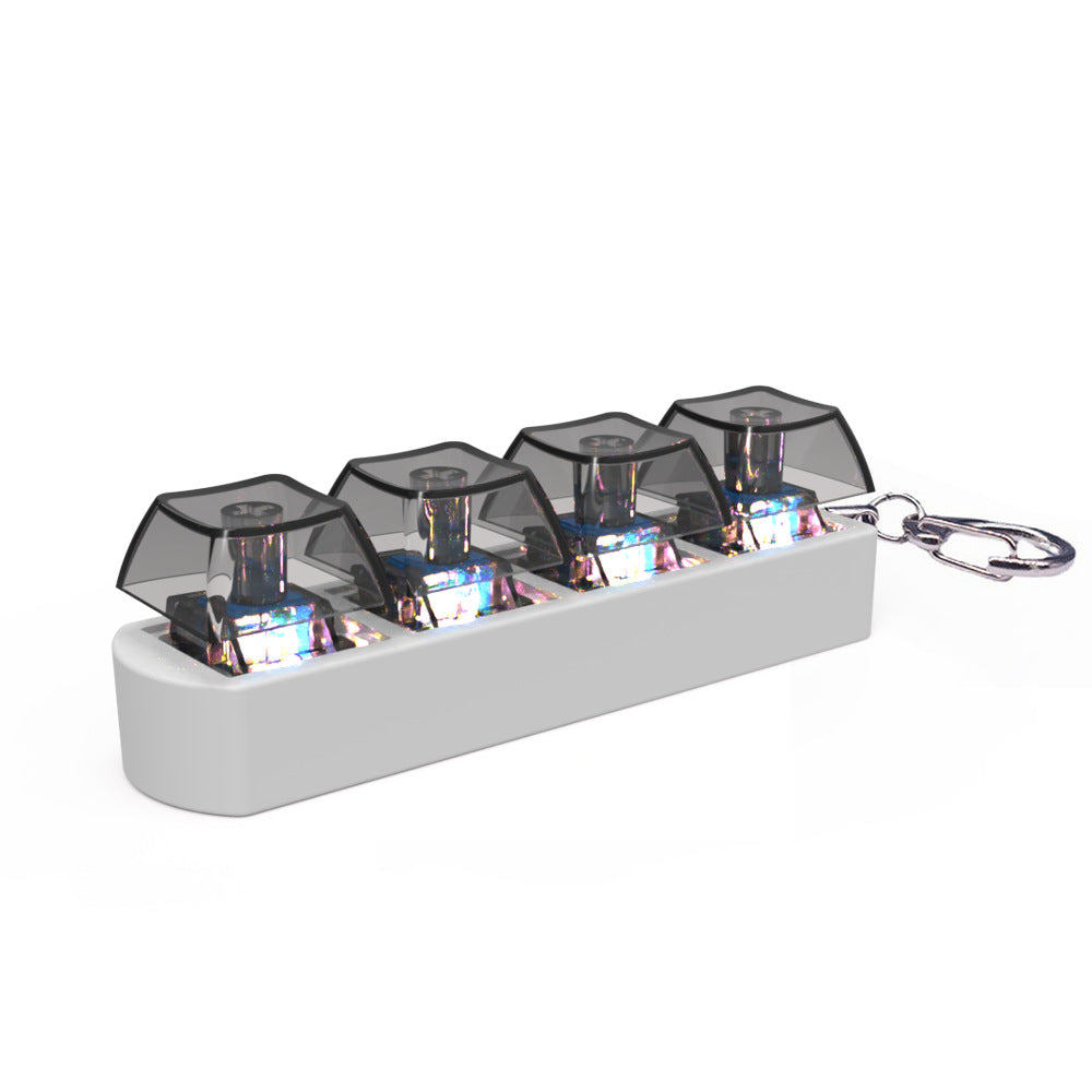 Keychain with transparent compartments containing small electronic components on a white background
