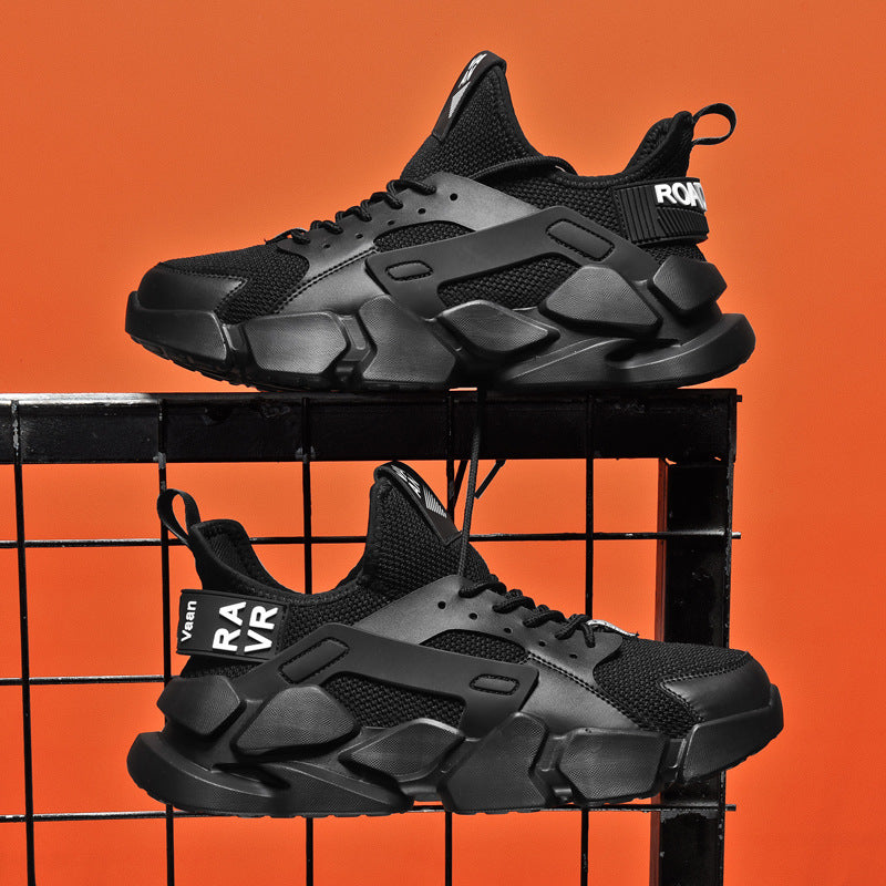 Black sneakers on a black metal stand against an orange background