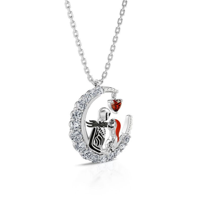 Silver necklace with a heart-shaped pendant featuring a couple and a red heart on a white background