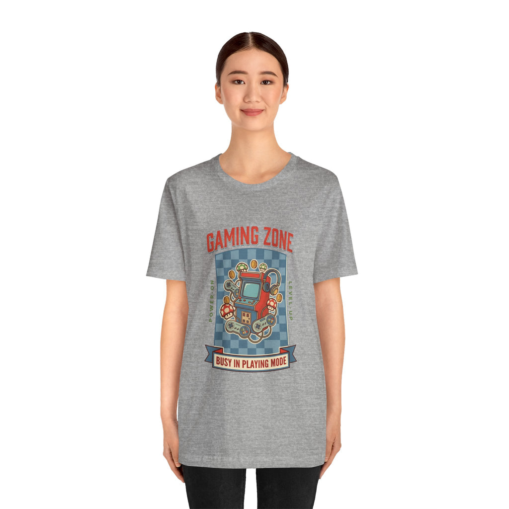 Person wearing a gray t-shirt with 'Gaming Zone' graphic design on a white background