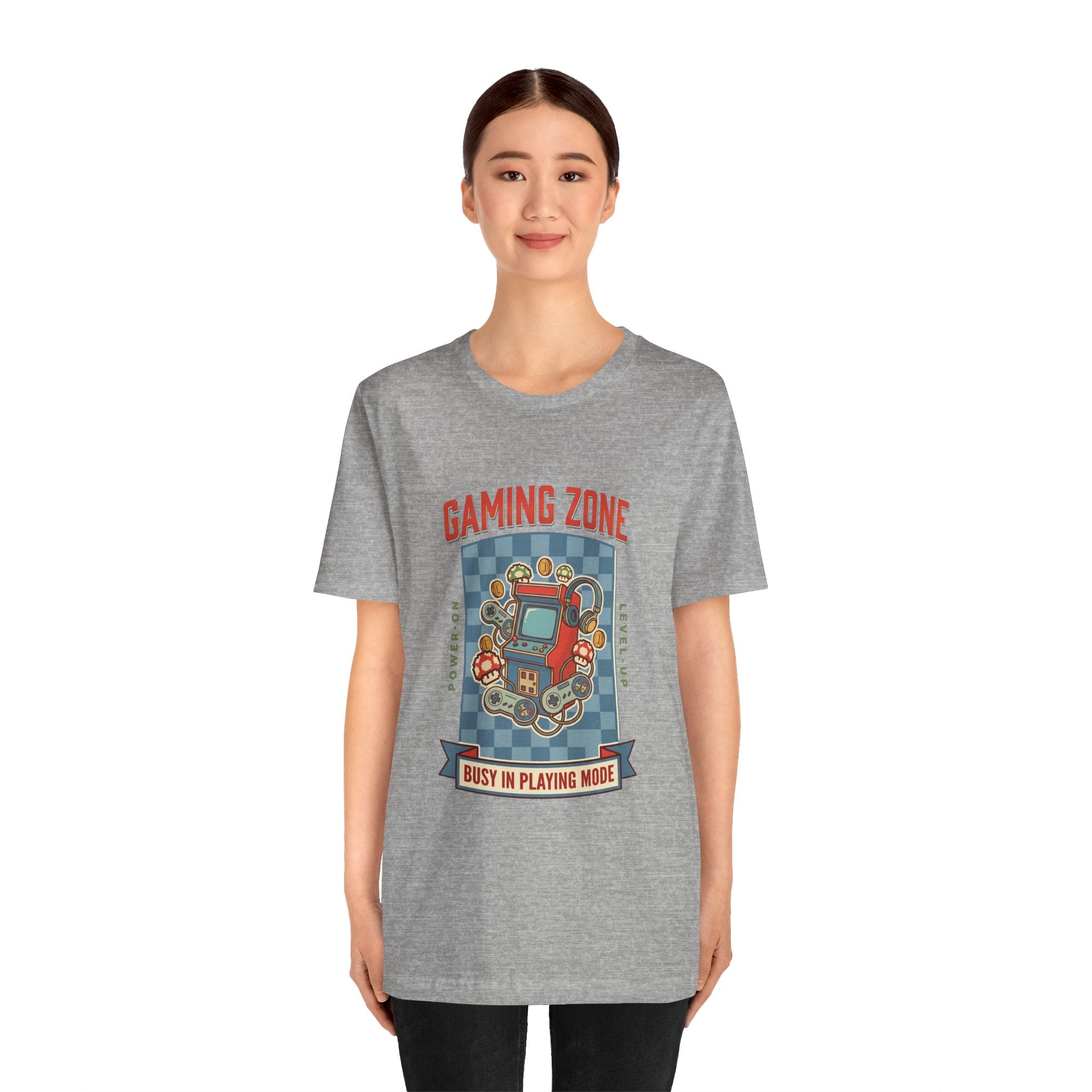 Person wearing a gray t-shirt with 'Gaming Zone' graphic design on a white background