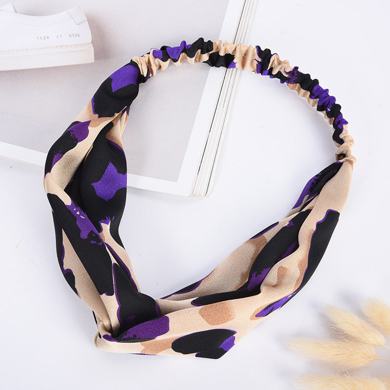 Necklace with purple and beige pattern on a white background