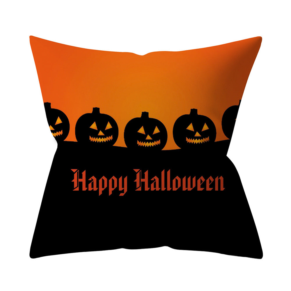 Halloween-themed pillow with jack-o'-lanterns and 'Happy Halloween' text on an orange and black background.