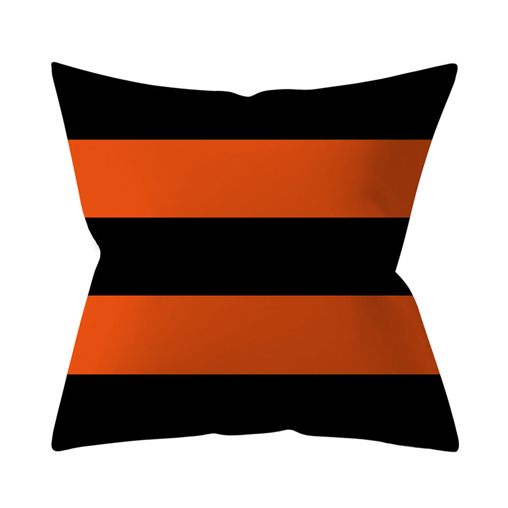 Decorative pillow with black and orange stripes on a white background