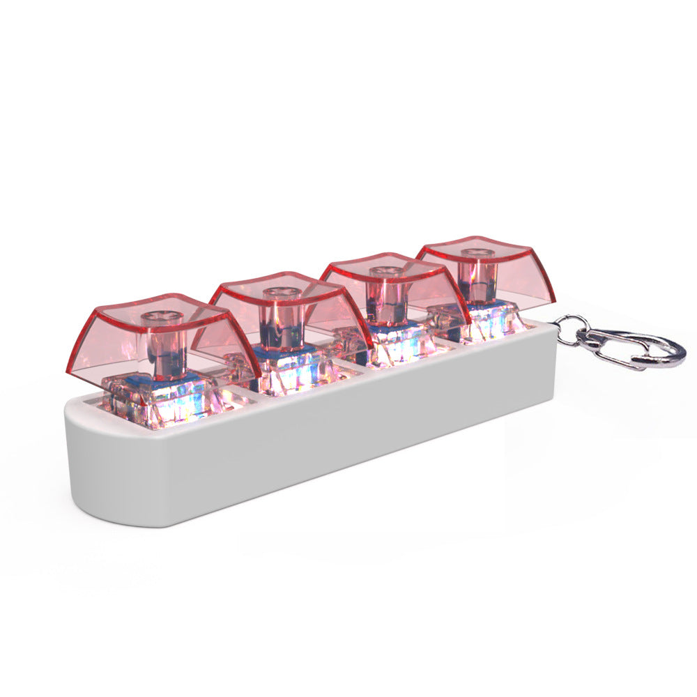 Keychain with transparent red compartments and a white base on a white background