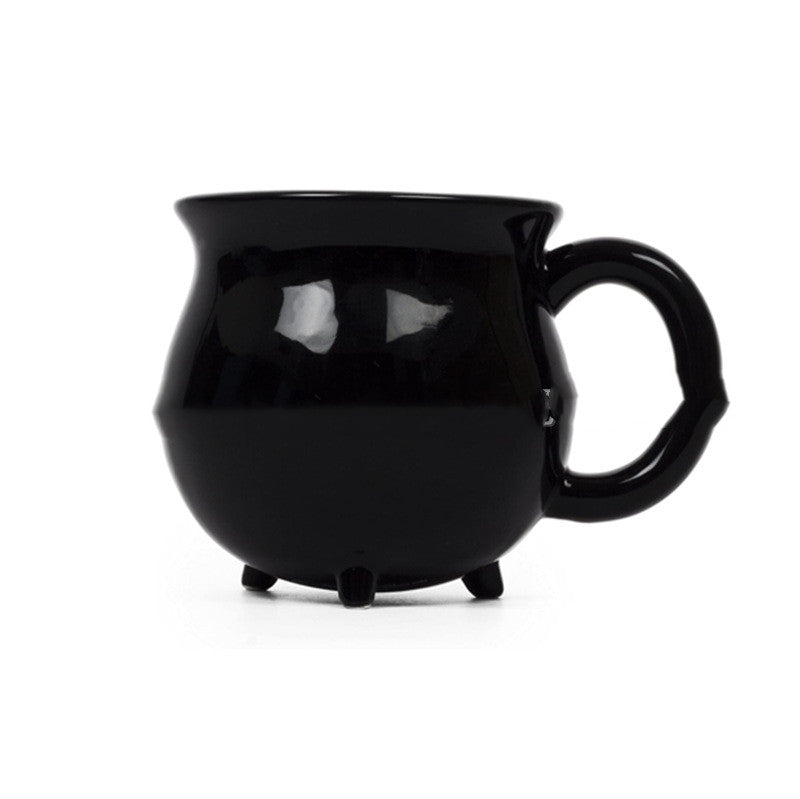 Black mug with a unique design on a white background