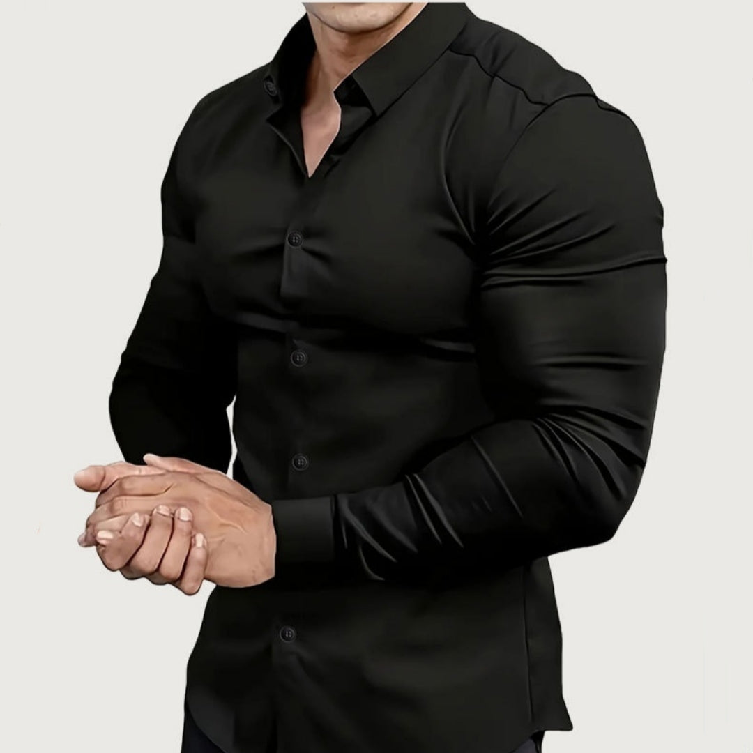 Person wearing a black dress shirt on a plain background