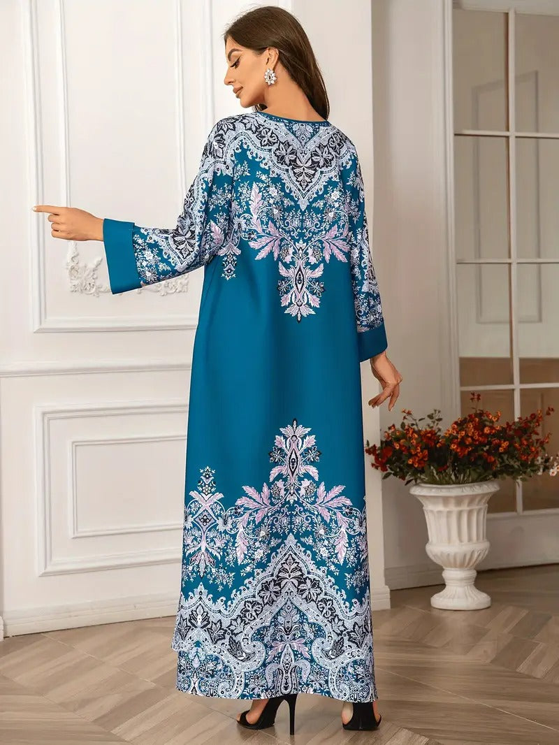 Woman wearing a blue and white patterned dress in an indoor setting.