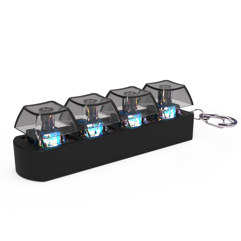 Black keychain with transparent compartments containing small electronic components on a white background