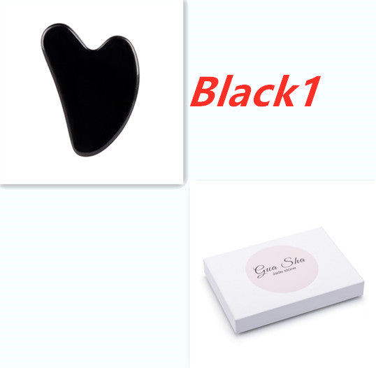 Black Gua Sha tool with packaging labeled 'Black1' on a white background
