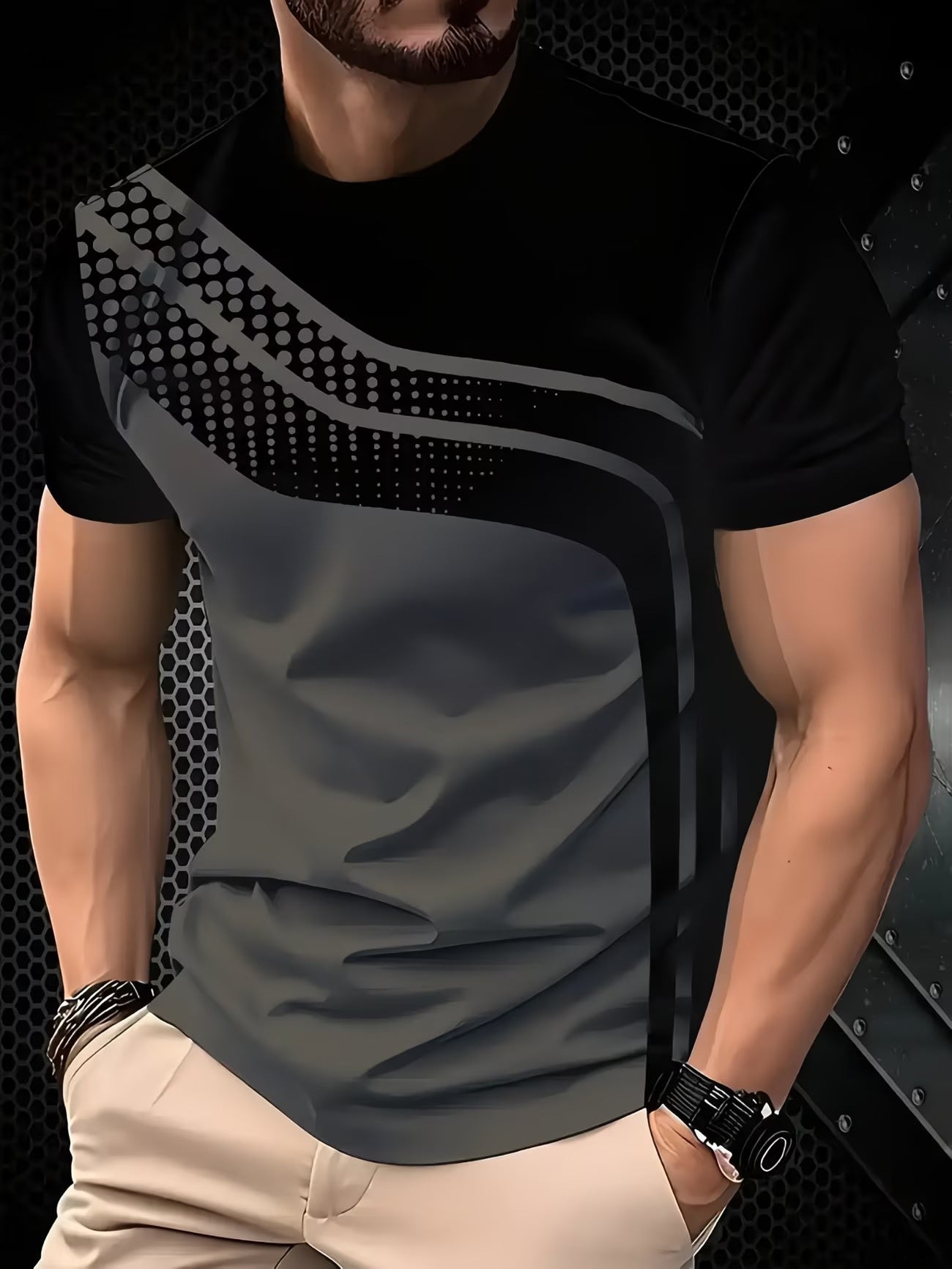 Man wearing a black and gray graphic t-shirt against a dark textured background