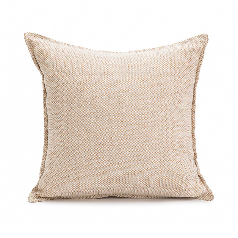 Beige textured pillow on a white background