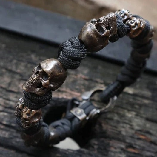 Bracelet with skull-shaped beads on a dark surface