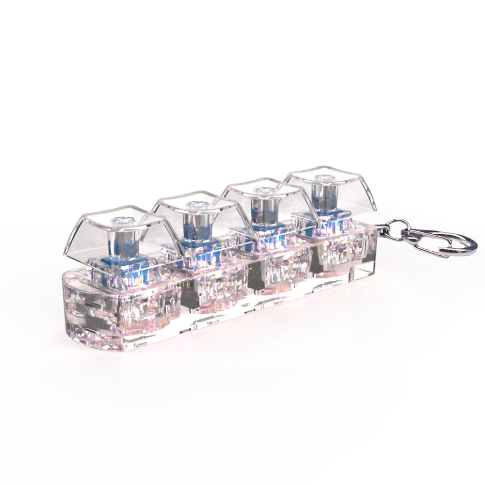 Clear plastic keychain with small compartments on a white background