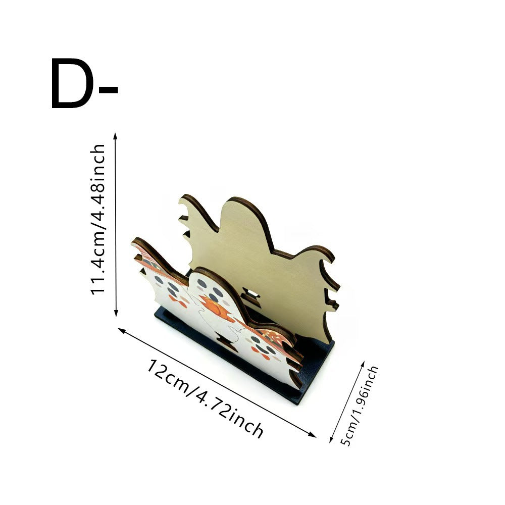 A small decorative wooden stand or holder with a ghost-like silhouette design, shown on a white background with dimension labels indicating 11.4 cm height, 12 cm width, and 5 cm depth.