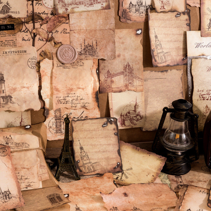 Vintage-style letters with illustrations and a lantern on a textured surface