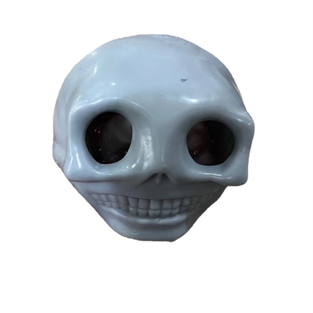 Skull-shaped fidget toy squishy stress relief on a white background