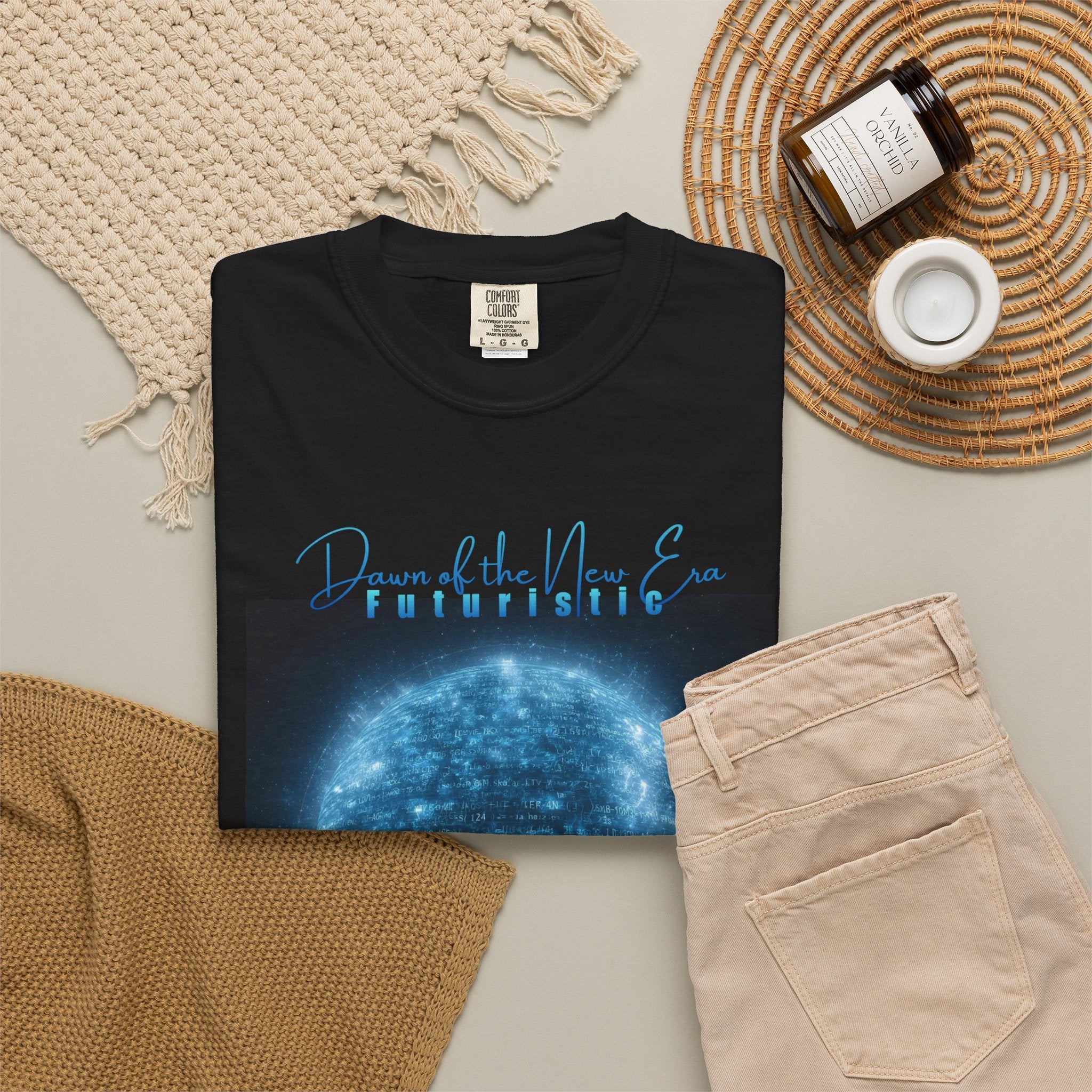 Black sweatshirt with futuristic design and text on a neutral surface with accessories.
