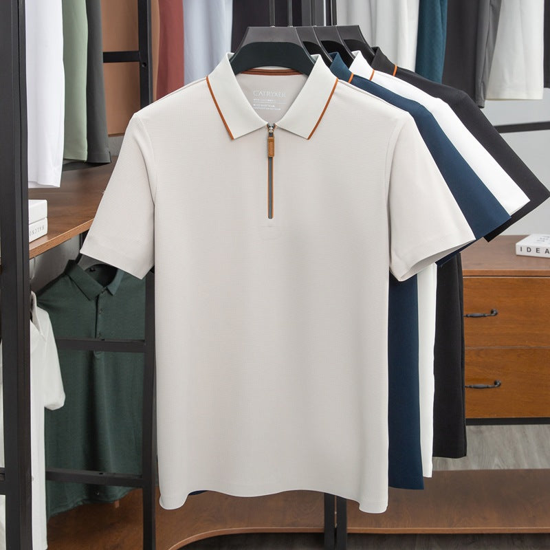 White polo shirt with zipper on a hanger in a clothing store setting