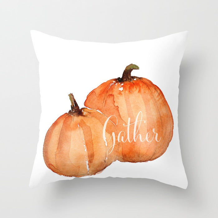 Pillow with pumpkins and 'Gather' text on a white background