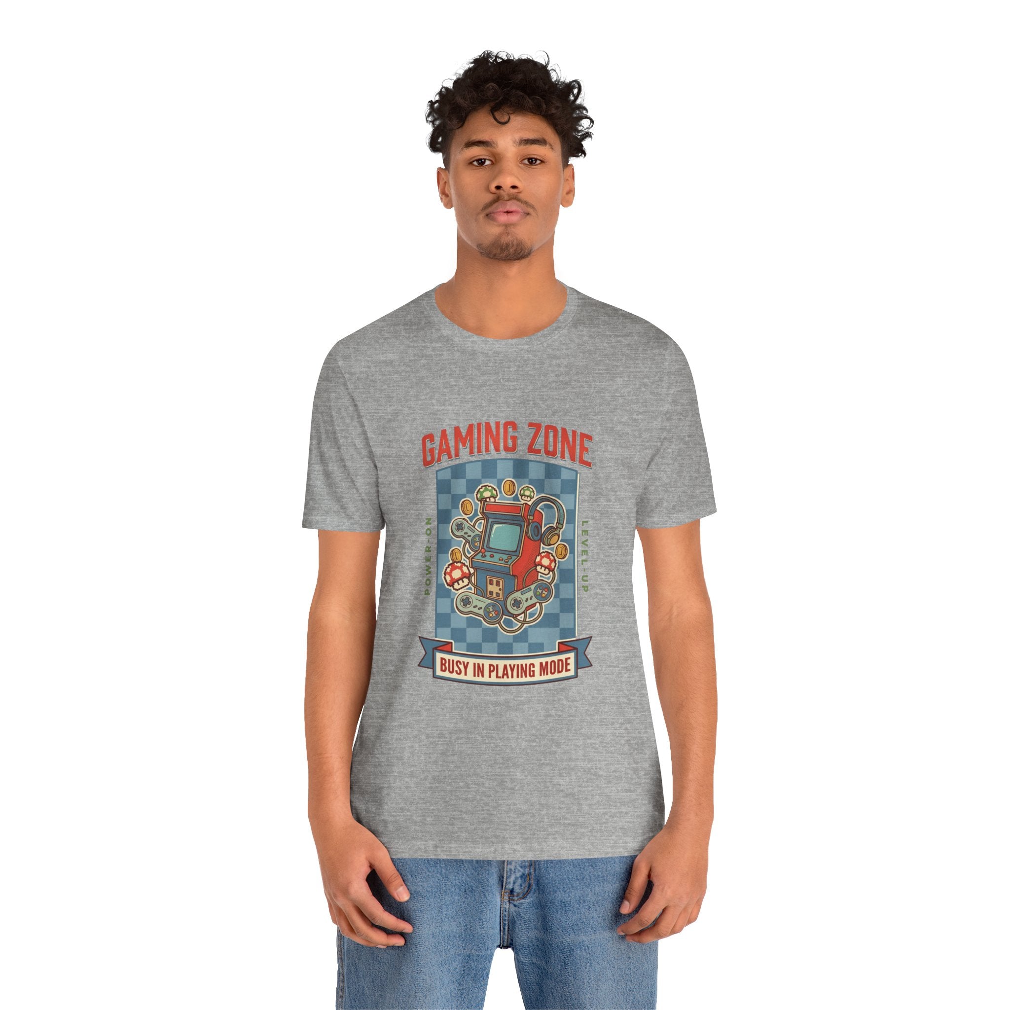 Person wearing a gray t-shirt with a black graphic design on a white background