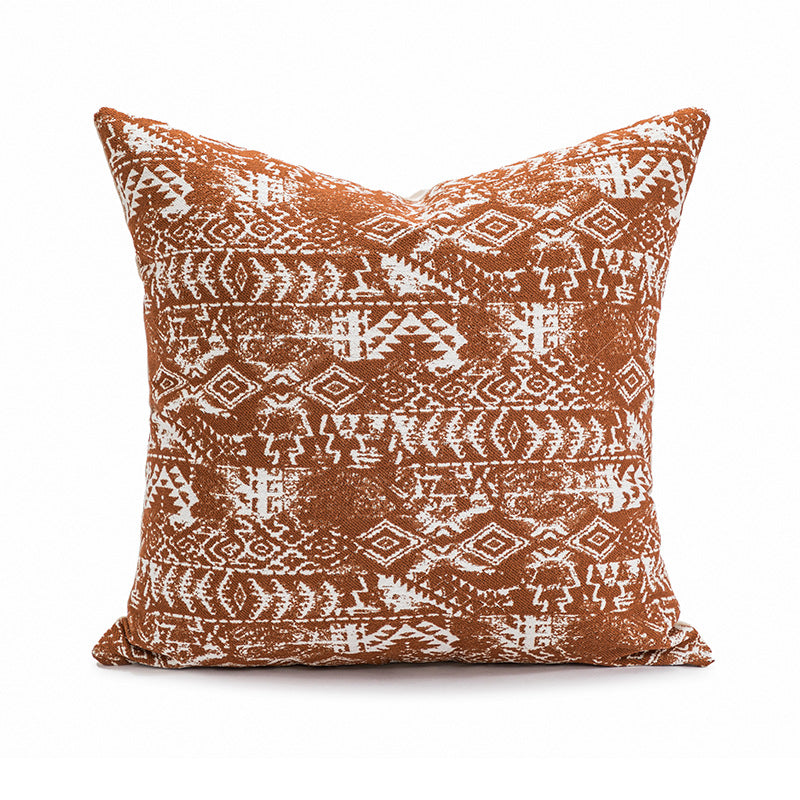 Decorative pillow with tribal pattern on a white background