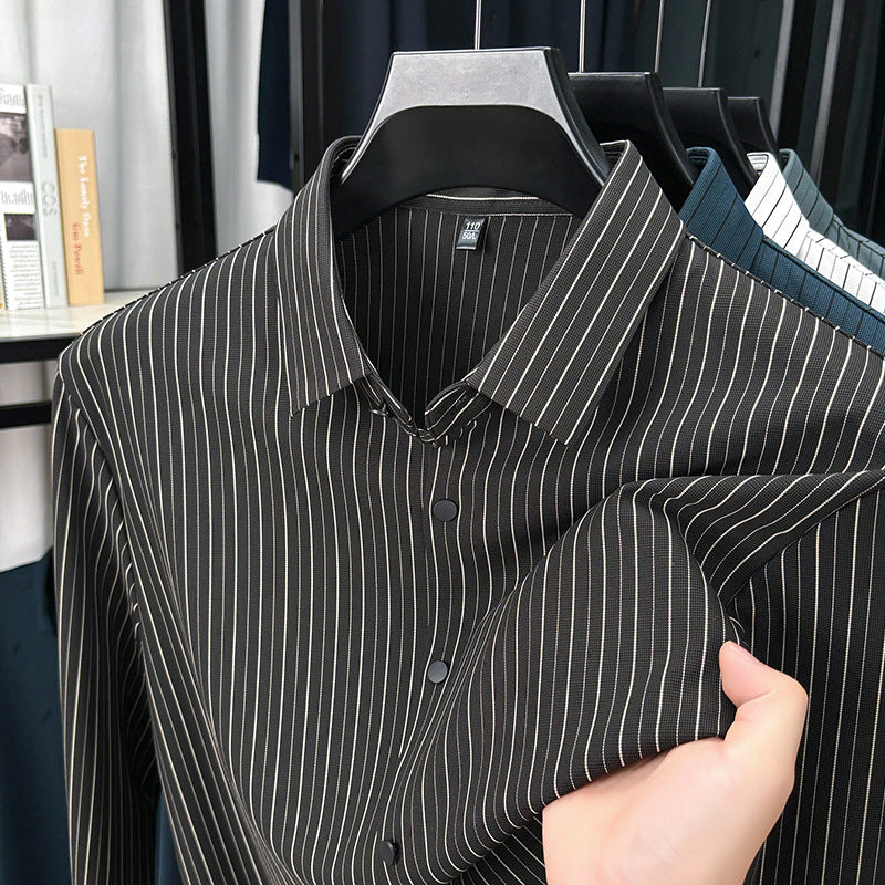 Black and white striped shirt on a hanger with a blurred background