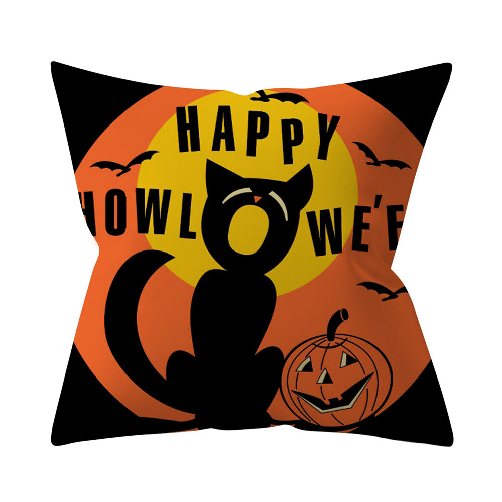 Halloween-themed pillow with a black cat, pumpkin, and text on an orange background.